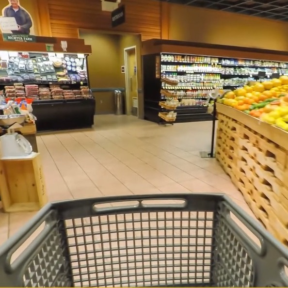 Image of shopping cart and grocery aisle