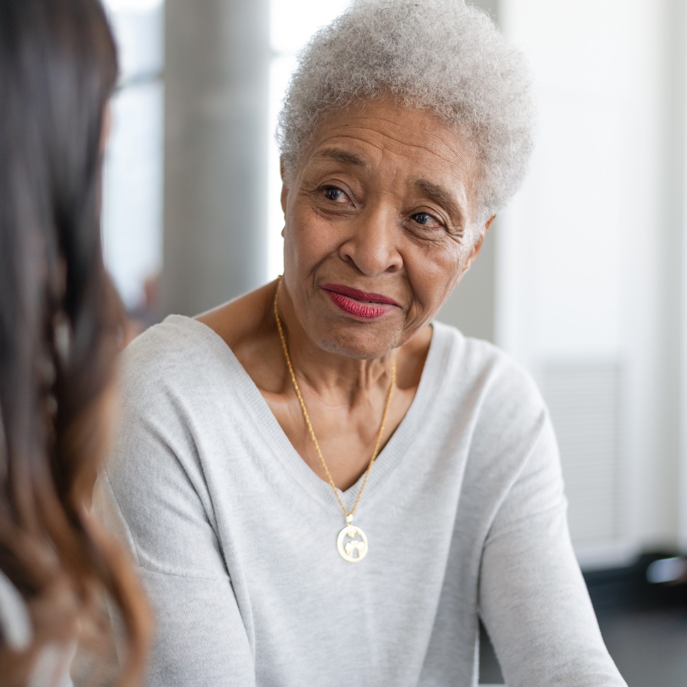 Woman looking at her doctor