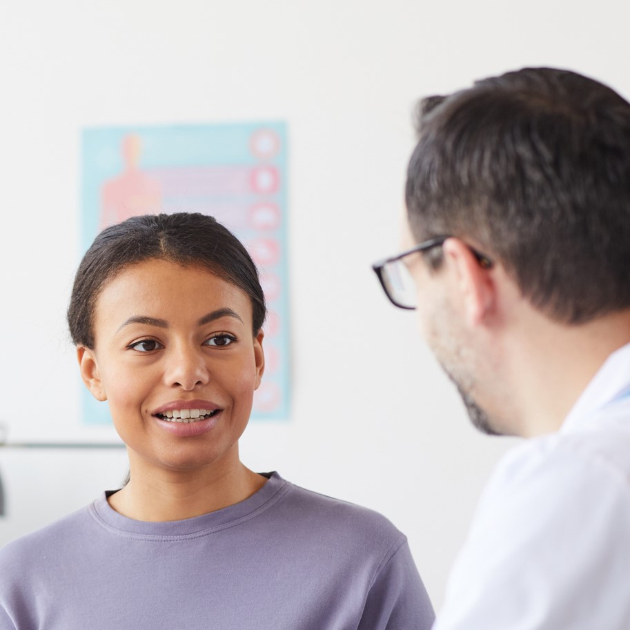 Woman talking to doctor