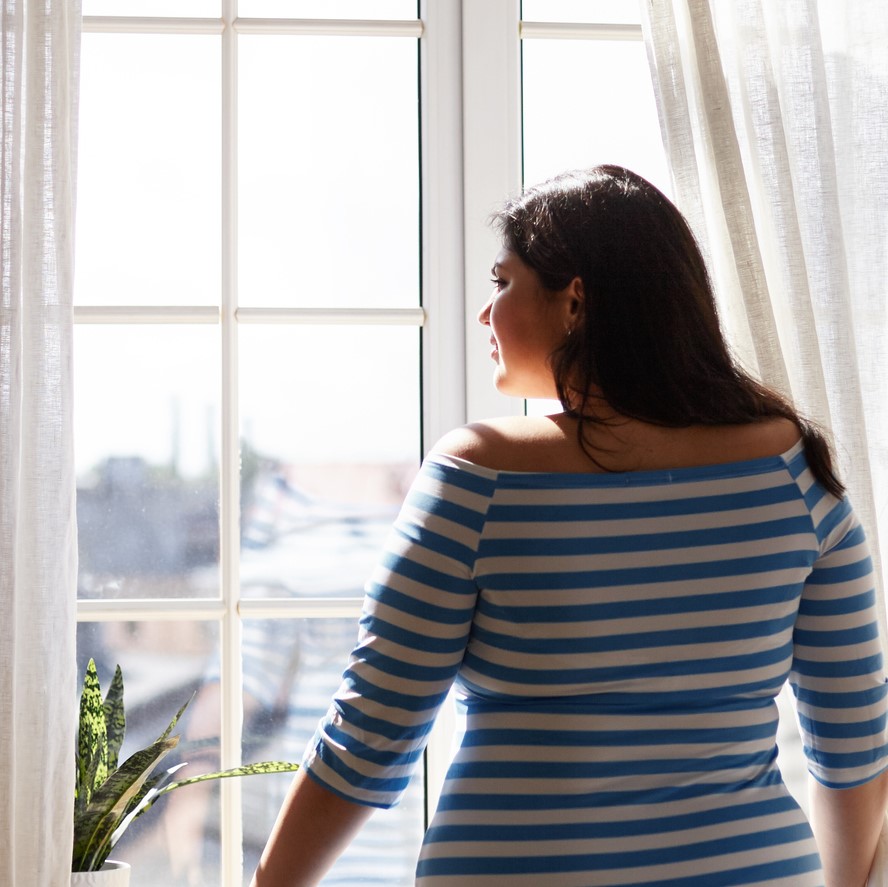 person looking out the window