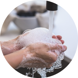 Hands being washed with soap and water